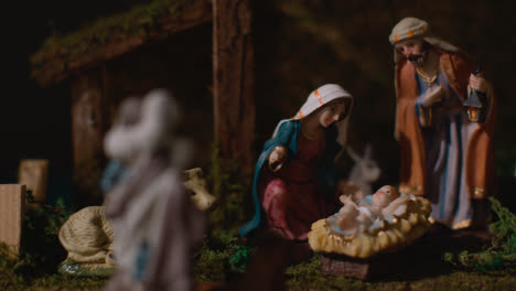Studio-Christmas-Concept-Of-Baby-Jesus-In-Manger-With-Figures-From-Nativity-Scene-7