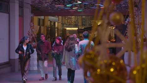 Christmas-Lights-And-Decorations-With-Shoppers-In-Covent-Garden-London-UK-At-Night