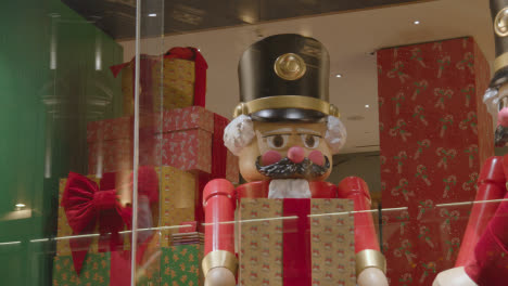 Shoppers-On-London-UK-Regent-Street-Walk-Past-Hamley's-Toy-Store-Window-Display-At-Night-1