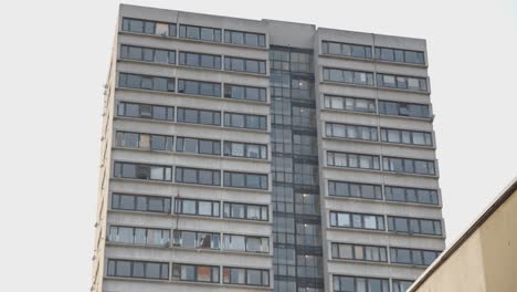 Defocused-Shot-Of-Inner-City-Housing-Development-With-High-Rise-Tower-Block-In-London-UK