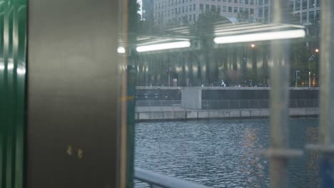 Modern-Offices-And-Workers-At-Canada-Square-Canary-Wharf-In-London-Docklands-UK-Through-Window