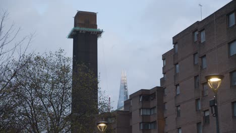 Exterior-Of-Tate-Modern-Art-Gallery-With-The-Shard-Behind-On-London's-South-Bank