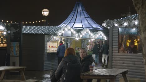 Busy-Christmas-Market-Food-Stalls-On-London-South-Bank-At-Dusk