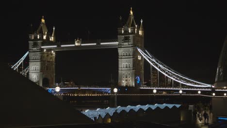 Busy-Christmas-Market-Stalls-Looking-Towards-Tower-Bridge-On-London-South-Bank-At-Night-3