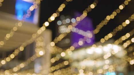 Defocused-Shot-Of-Christmas-Lights-Along-South-Bank-In-London-At-Night