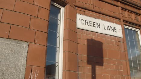 Street-Sign-For-Green-Lane-Outside-Masjid-Mosque-And-Community-Centre-In-Birmingham-UK