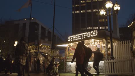 Busy-Christmas-Market-Food-Stalls-In-Birmingham-UK-At-Dusk-5