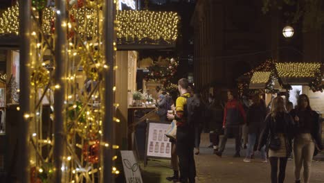 Busy-Christmas-Market-Food-Stalls-In-Birmingham-UK-At-Dusk-9