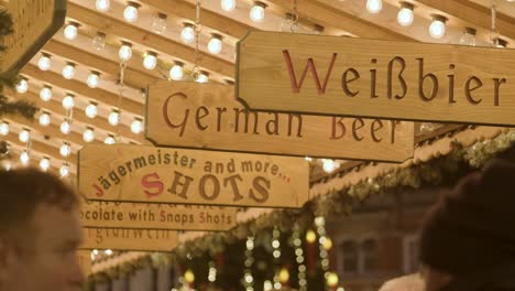 Signs-On-Food-Stalls-At-Frankfurt-Christmas-Market-In-Birmingham-UK-At-Night-1