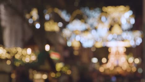 Defocused-Christmas-Lights-Above-Shops-In-New-Street-In-Birmingham-UK-At-Night-2