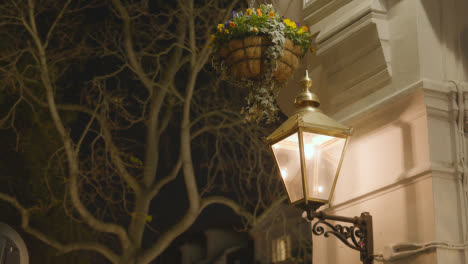 Close-Up-Of-Lamp-And-Hanging-Basket-Outside-Exclusive-Luxury-Housing-In-Belgravia-London-At-Night