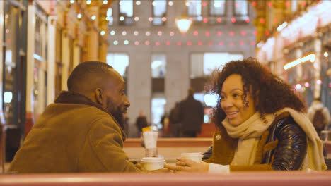Couple-Meeting-For-Hot-Drink-At-Table-At-Outdoor-Cafe-In-Leadenhall-Market-London-UK-3
