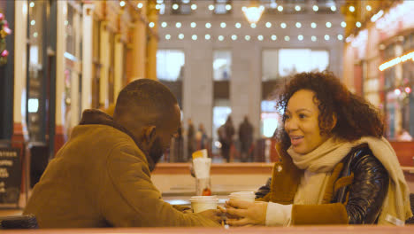Couple-Meeting-For-Hot-Drink-At-Table-At-Outdoor-Cafe-In-Leadenhall-Market-London-UK-4