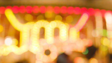 Defocused-Shot-Of-Lights-On-Fairground-Roundabout-On-London-South-Bank-At-Night-1