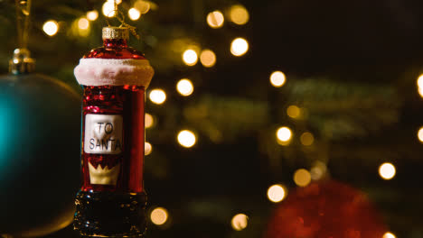 Close-Up-Of-Lights-And-Post-Box-Shaped-Bauble-On-Christmas-Tree-1