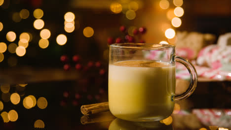 Christmas-At-Home-With-Person-Drinking-Glass-Of-Eggnog