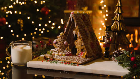 Christmas-Food-At-Home-With-Gingerbread-House-And-Milk-On-Table-3