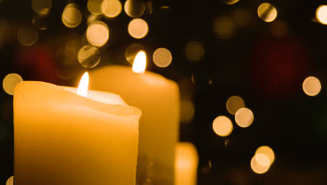 Close-Up-Of-Candles-By-Christmas-Tree-At-Home-1