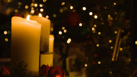 Close-Up-Of-Candles-By-Christmas-Tree-At-Home-2