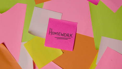 Education-Concept-Of-Revolving-Sticky-Notes-With-Homework-Written-On-Top-Note
