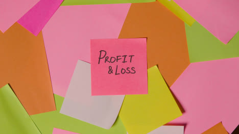 Business-Concept-Of-Revolving-Sticky-Notes-With-Profit-And-Loss-Written-On-Top-Note
