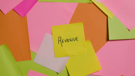 Business-Concept-Of-Revolving-Sticky-Notes-With-Revenue-Written-On-Top-Note