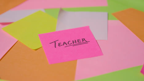 Education-Concept-Of-Revolving-Sticky-Notes-With-Teacher-Written-On-Top-Note-1