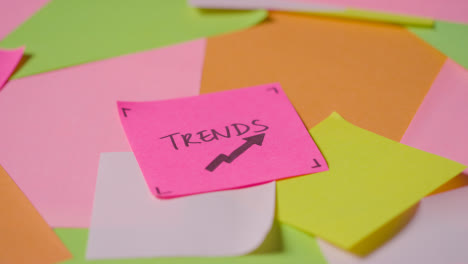 Business-Concept-Of-Revolving-Sticky-Notes-With-Trends-Written-On-Top-Note-1