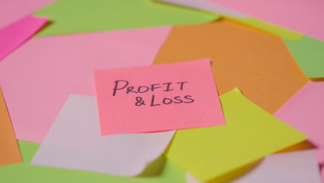 Business-Concept-Of-Revolving-Sticky-Notes-With-Profit-And-Loss-Written-On-Top-Note-1
