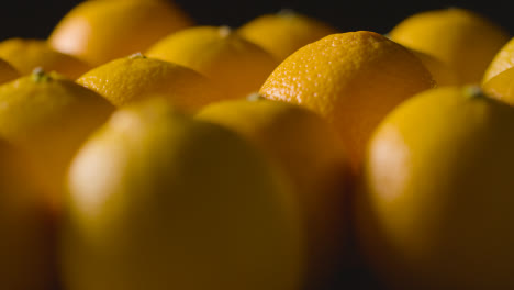 Studio-Shot-Of-Oranges-Revolving-Against-Black-Background