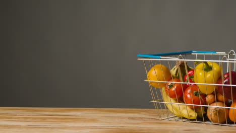 Studio-Shot-Of-Basic-Fresh-Fruit-And-Vegetable-Food-Items-In-Supermarket-Wire-Shopping-Basket-2