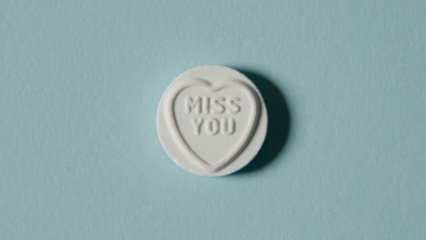 Heart-Candy-With-Miss-You-Message-On-Blue-Background