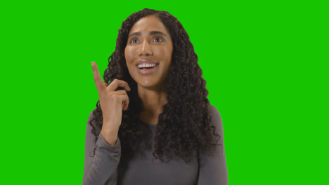 Portrait-Of-Woman-Being-Inspired-By-Good-Idea-Against-Green-Screen-At-Camera-2