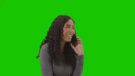 Frustrated-Woman-Talking-On-Mobile-Phone-Against-Green-Screen-Before-Hanging-Up