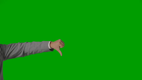Close-Up-Of-Arm-Of-Businessman-In-Suit-Choosing-Between-Thumbs-Down-And-Down-Gesture-Against-Green-Screen-