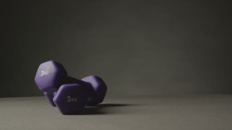 Fitness-Studio-Shot-Of-Exercise-Dumbbell-Weights-Against-Grey-Background-9