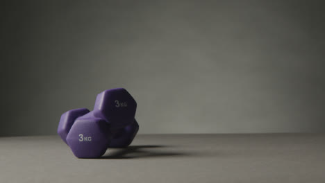 Fitness-Studio-Shot-Of-Exercise-Dumbbell-Weights-Against-Grey-Background-10