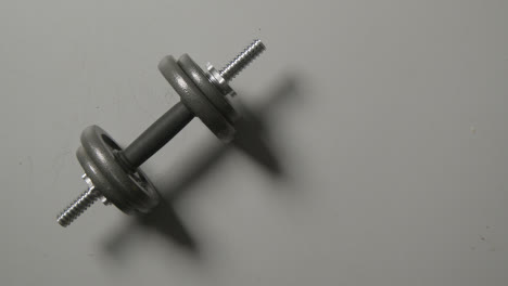 Overhead-Studio-Fitness-Shot-Of-Gym-Weight-On-Grey-Background-With-Shadows-1