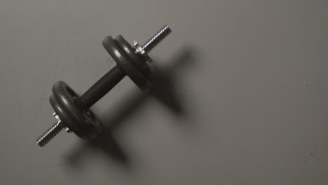 Overhead-Studio-Fitness-Shot-Of-Gym-Weight-On-Grey-Background-With-Shadows-2