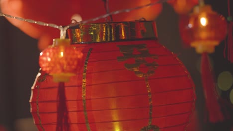 Close-Up-Of-Colourful-Chinese-Lanterns-And-Lights-Celebrating-New-Year-Hung-Against-Black-Background-2