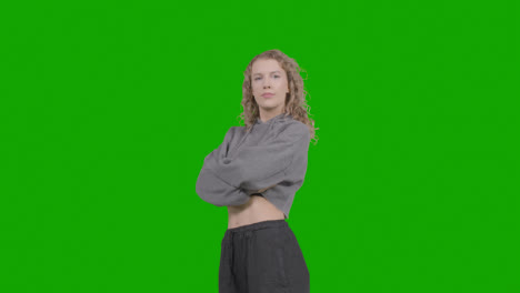 Studio-Portrait-Of-Young-Woman-With-Attitude-Against-Green-Screen-1