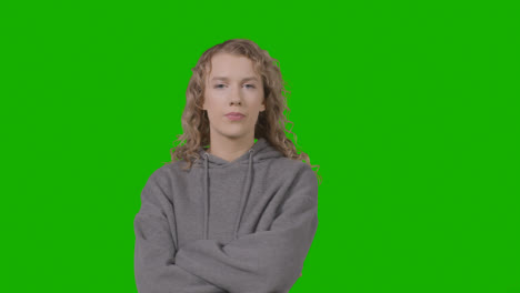 Studio-Portrait-Of-Young-Woman-With-Attitude-Against-Green-Screen-2