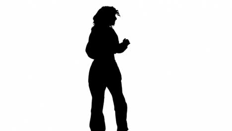 Studio-Silhouette-Of-Woman-Dancing-Against-White-Background