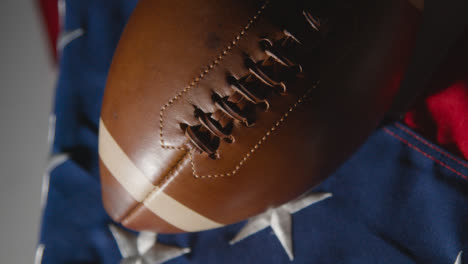 Close-Up-Studio-Shot-Of-American-Football-On-Stars-And-Stripes-Flag-9