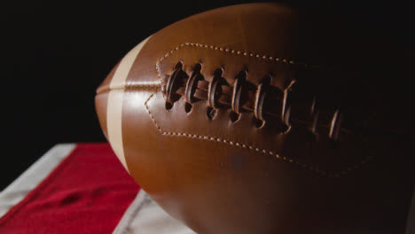 Close-Up-Studio-Shot-Of-American-Football-On-Stars-And-Stripes-Flag-10