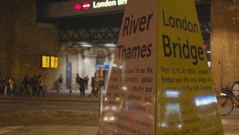 Entrance-To-London-Bridge-Rail-Station-With-Tourist-Information-At-Night