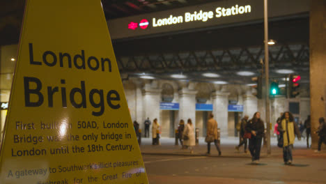 Entrance-To-London-Bridge-Rail-Station-With-Tourist-Information-At-Night-1
