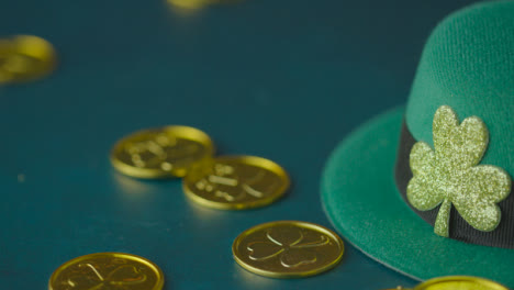 Studio-Shot-Of-Green-Leprechaun-Top-Hat-And-Piles-Of-Gold-Coins-To-Celebrate-St-Patricks-Day-7