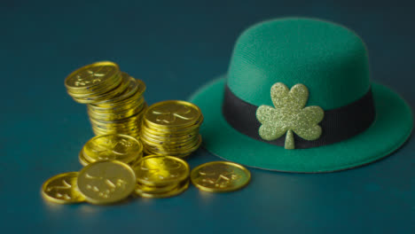 Studio-Shot-Of-Green-Leprechaun-Top-Hat-And-Piles-Of-Gold-Coins-To-Celebrate-St-Patricks-Day-9