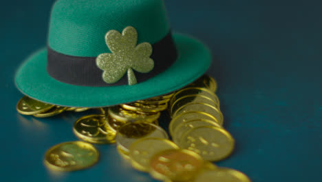 Studio-Shot-Of-Green-Leprechaun-Top-Hat-And-Piles-Of-Gold-Coins-To-Celebrate-St-Patricks-Day-10